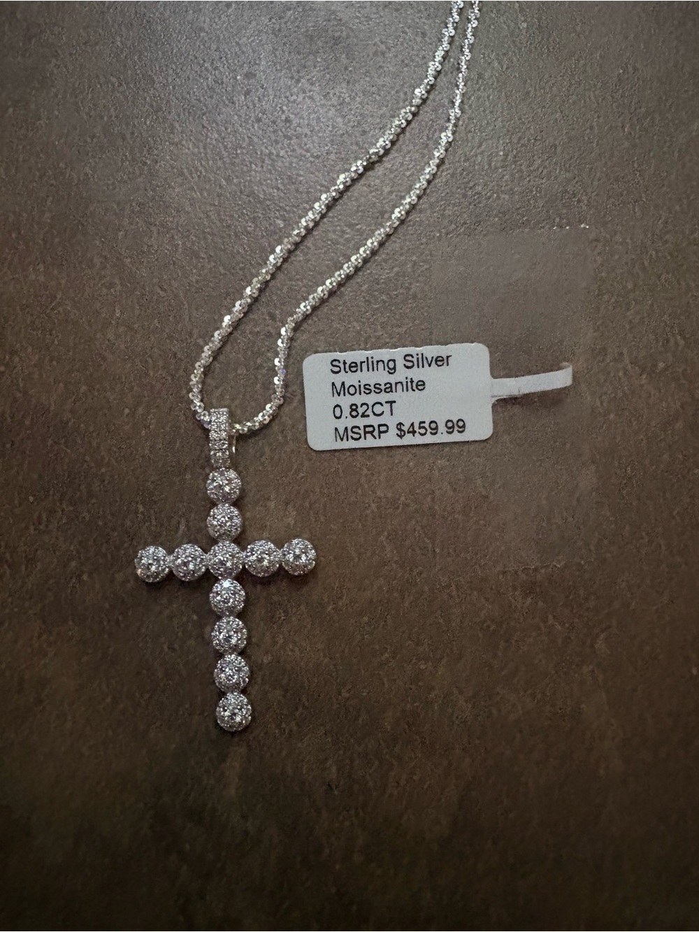 Sterling silver with .82ct Moissanite stones on the Cross Pendant stamped 925